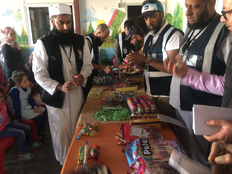 Sometimes a few sweets can help to bring cheer to the lives of orphaned refugees